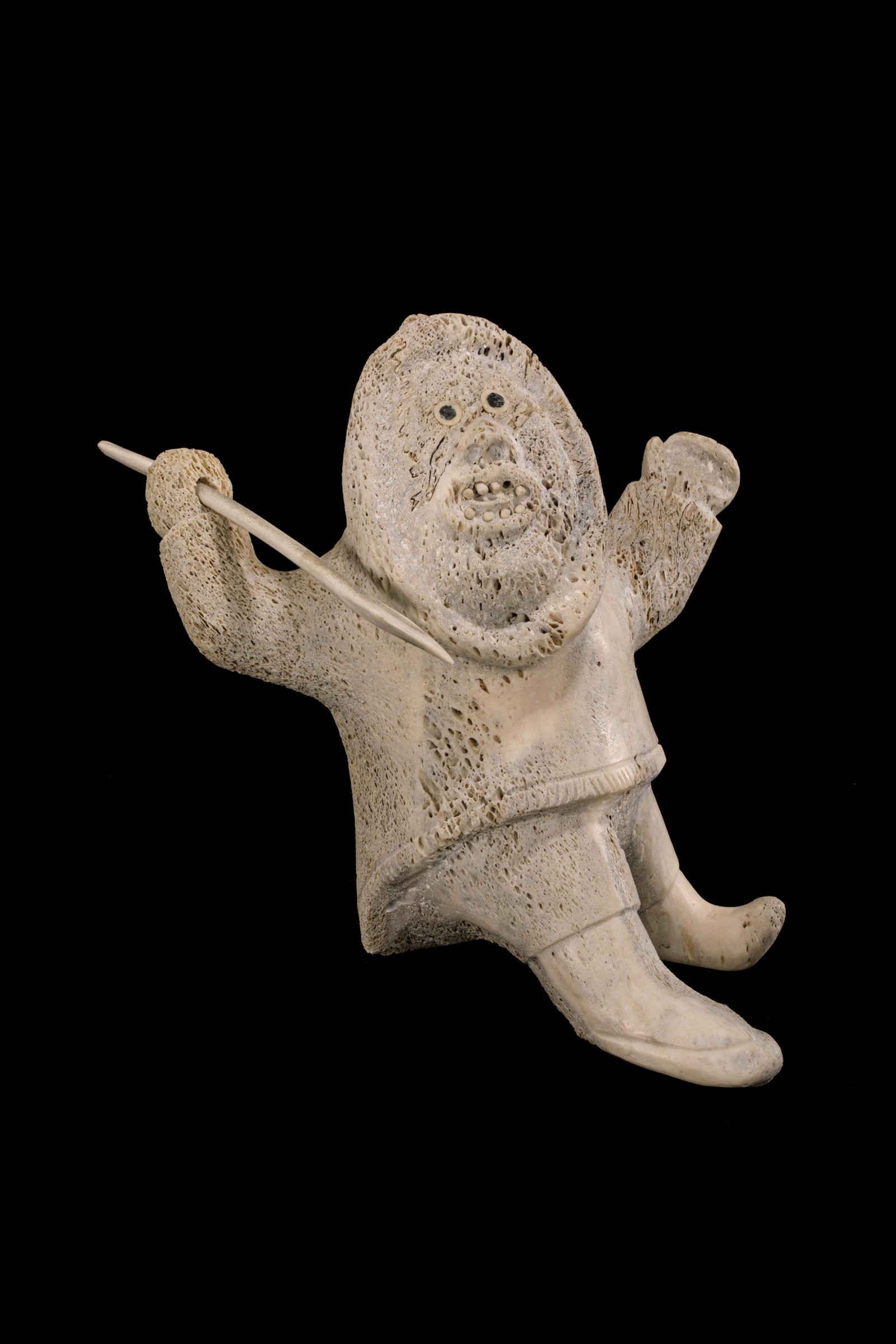 TOMMY ASHEVAK, INUIT, Excited Hunter with Harpoon, 1980s: TOMMY ASHEVAK (1931-1996) TALOYOAK (SPENCE BAY) Excited Hunter with Harpoon, 1980s whalebone, antler, and stone, 11 x 10.5 x 14.75 in (27.9 x 26.7 x 37.5 cm) unsigned. Provenance Private Collection, T
