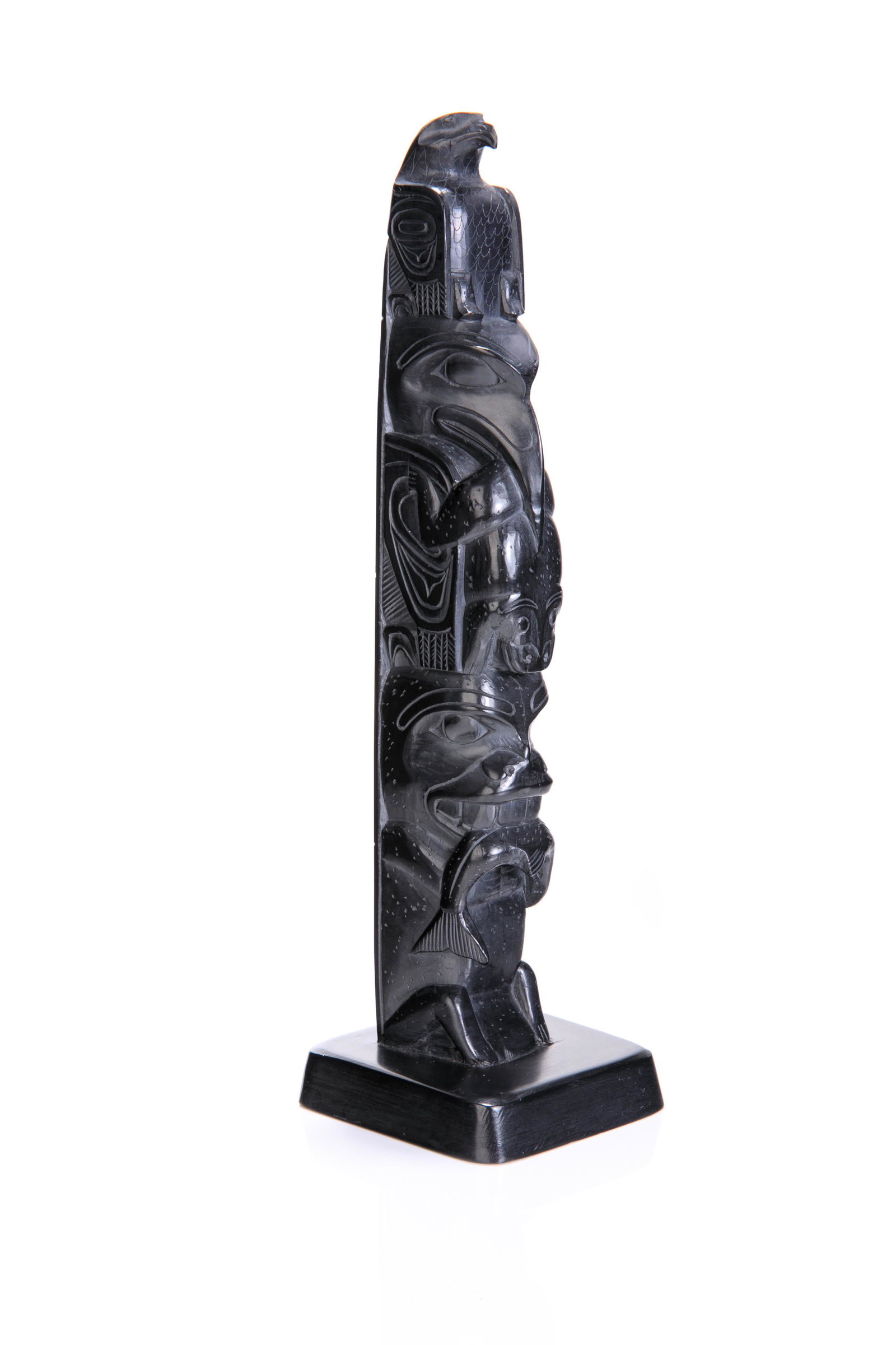 ARTHUR MOODY (1887-1967) SKIDEGATE, B.C., Model Totem Pole, mid-late 1940s: ARTHUR MOODY (1887-1967) SKIDEGATE, B.C. Model Totem Pole, mid-late 1940s argillite, 9 x 2.5 x 2.5 in (22.9 x 6.3 x 6.3 cm) signed and inscribed, "CARVED BY ARTHUR MOODY / SKIDEGATE MISSION B.C." Prov
