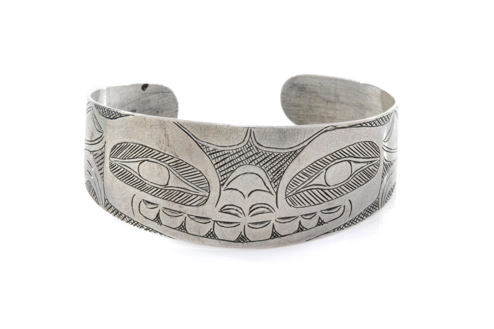 ATTR: JOHN CROSS (1867-1939) SKIDEGATE, HAIDA GWAII, Cuff Bracelet with Frontal Bear Design, c.: Attributed to JOHN CROSS (1867-1939) SKIDEGATE, HAIDA GWAII Cuff Bracelet with Frontal Bear Design, c. 1920 coin silver, 0.75 x 2 x 2 in (1.9 x 5.1 x 5.1 cm); circumference: 6.5 in (16.5 cm); weight: