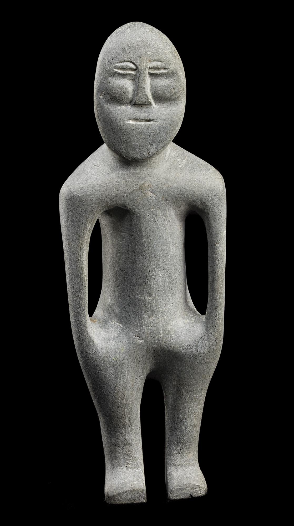 JOHN TIKTAK, R.C.A., INUIT, Standing Man, c. 1966-67: Lot 101 JOHN TIKTAK, R.C.A. (1916-1981) KANGIQLINIQ (RANKIN INLET) Standing Man, c. 1966-67 stone, 14.5 x 5 x 3.5 in (36.8 x 12.7 x 8.9 cm) signed, "ᑎᑕ". Provenance Inuit Gallery of Vancou