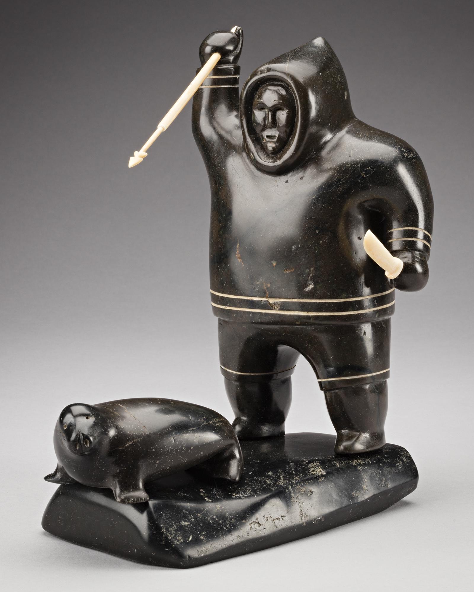 AKEEAKTASHUK, INUIT, Hunter Pursuing a Seal, c. 1951: Lot 116 AKEEAKTASHUK (1898-1954) INUKJUAK (PORT HARRISON) Hunter Pursuing a Seal, c. 1951 stone, walrus tusk, and soap inlay, 9.5 x 9.25 x 5.5 in (24.1 x 23.5 x 14 cm) unsigned. Provenance Private Col