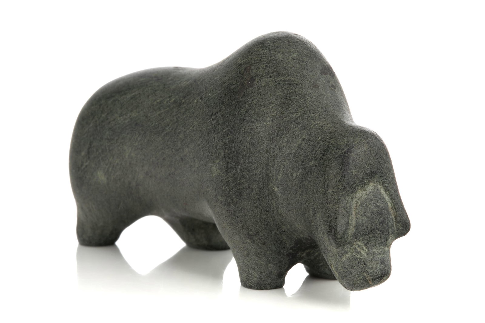 DAVID IKUTAAQ, INUIT, Muskox, early 1970s: DAVID IKUTAAQ (1929-1984) QAMANI'TUAQ (BAKER LAKE) Muskox, early 1970s stone, 1 x 2.25 x 0.75 in (2.5 x 5.7 x 1.9 cm) signed, "ᐃᑯᑕ". Provenance Collection of Mr. Jack Butler, acquire