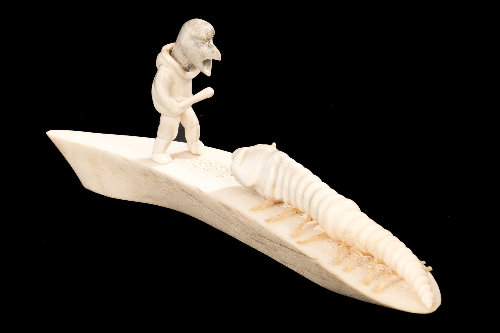 NICK SIKKUARK, INUIT, Bird Shaman Approaching Worm Creature, 1981: NICK SIKKUARK (1943-2013) KUGAARUK (PELLY BAY) / UQSUQTUUQ (GJOA HAVEN) Bird Shaman Approaching Worm Creature, 1981 antler and waxed string, 2.75 x 7.5 x 2 in (7 x 19.1 x 5.1 cm) signed, "Nick Sikkuar