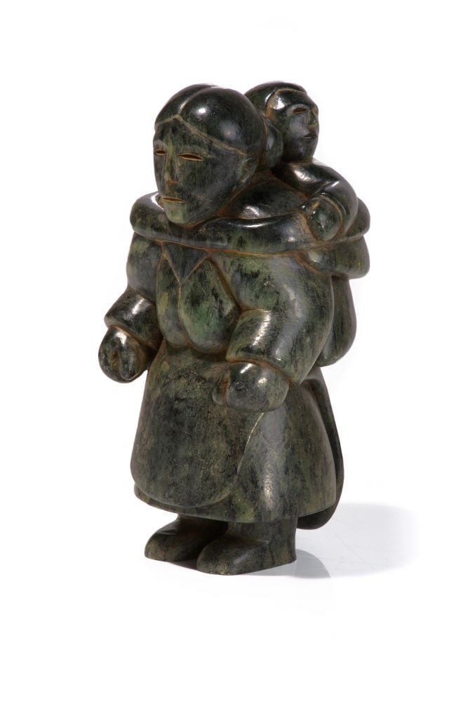 UNIDENTIFIED INUIT ARTIST, Mother with Child in Her Amaut, early 1960s: UNIDENTIFIED ARTIST, EASTERN CANADIAN ARCTIC Mother with Child in Her Amaut, early 1960s stone, 8 x 3.75 x 4.25 in (20.3 x 9.5 x 10.8 cm) unsigned. Provenance Private Collection, Hamilton, ON; Estate