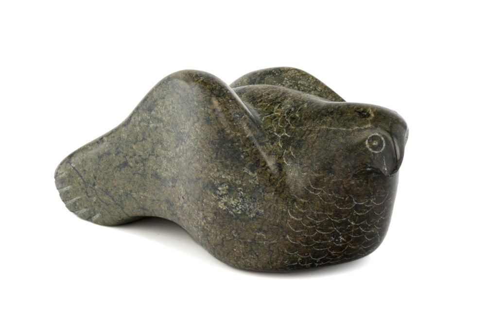 MARKUSI KAPPIK LAUJA, INUIT, Resting Snowy Owl, c. 1980s: MARKUSI KAPPIK LAUJA, QIKIQTAALUK (NORTH BAFFIN) Resting Snowy Owl, c. 1980s stone, 2 x 5.25 x 2.25 in (5.1 x 13.3 x 5.7 cm) signed, "ᒪᕆᑭᓯ ᑯᐸ ᓚᐅᔭ.