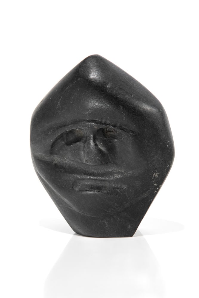 JOHN KAVIK, INUIT, Head of a Speaking Man, 4 February 1976: JOHN KAVIK (1897-1993) KANGIQLINIQ (RANKIN INLET) Head of a Speaking Man, 4 February 1976 stone, 7.25 x 5.75 x 2.5 in (18.4 x 14.6 x 6.3 cm) apparently unsigned, underside obscured by igloo sticker, d