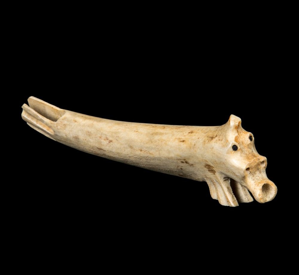 UNIDENTIFIED ARTIST, INUIT, Swimming Sea Spirit, c. 1970s: UNIDENTIFIED ARTIST, PROBABLY KANGIQSUALUJJUAQ (GEORGE RIVER) Swimming Sea Spirit, c. 1970s antler and black inlay, 1.75 x 6.25 x 1 in (4.4 x 15.9 x 2.5 cm) unsigned. Provenance A Toronto Collection.