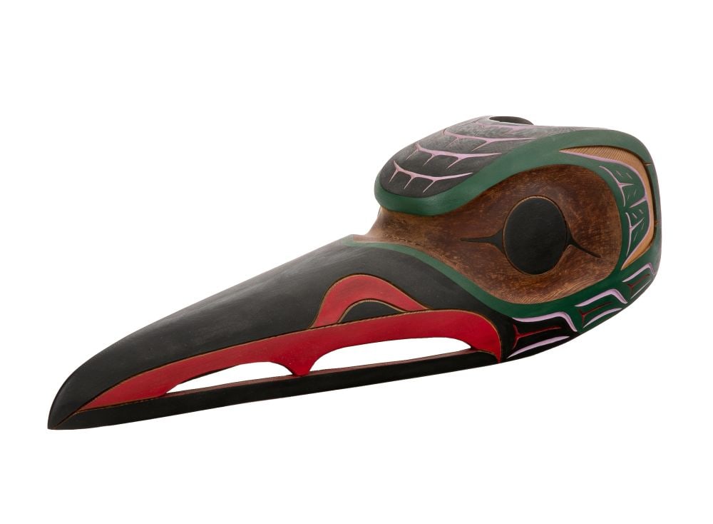 ISAAC (IKE) CHARLIE, NUU-CHAH-NULTH, Hummingbird Head Mask, c. 1990s: ISAAC (IKE) CHARLIE (c. 1967-) NUU-CHAH-NULTH Hummingbird Head Mask, c. 1990s cedar wood and paint, 7 x 24.5 x 7 in (17.8 x 62.2 x 17.8 cm) titled and signed, "HUMMINGBIRD IKE C.". Provenance Private 