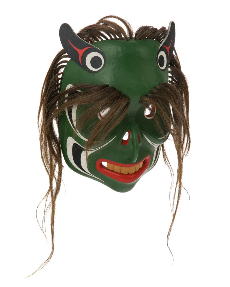 BEAU DICK, FIRST NATIONS, Bookwoos (Wild Man Mask), 1984: BEAU DICK (1955-2017) KWAKWA̱KA̱ʼWAKW Bookwoos (Ba̱k’wa̱s / Bukwus / Wild Man Mask), 1984 yellow cedar wood, acrylic paint, and synthetic hair, 10.25 x 7.25 x 4 in (24.1
