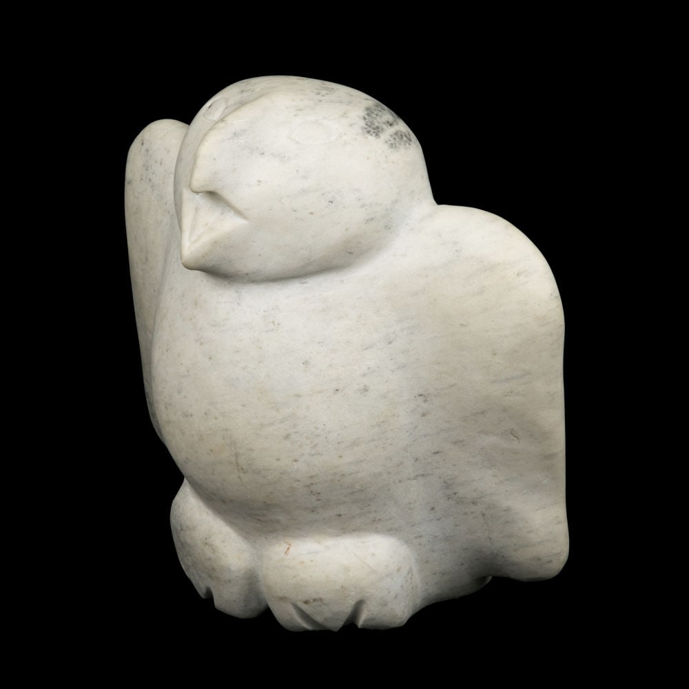 JOANASSIE IGIU, INUIT, Owl, mid-1970s: JOANASSIE IGIU (1923-1981) KINNGAIT (CAPE DORSET) Owl, mid-1970s stone, 11.5 x 11 x 6 in (29.2 x 27.9 x 15.2 cm) unsigned. Provenance Private Collection, USA. This owl simply exudes joy. Wit