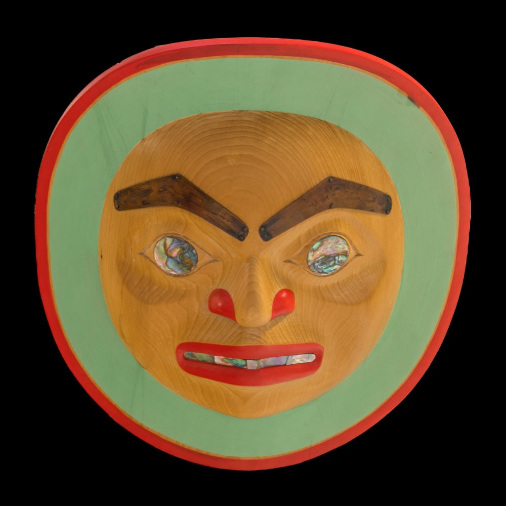 BEAU DICK, KWAKWA̱KA̱ʼWAKW, Moon Crest, 1988: BEAU DICK (1955-2017) KWAKWA̱KA̱ʼWAKW Moon Crest, 1988 wood, abalone, copper, and acrylic paint, 10.5 x 9.5 x 3 in (26.7 x 24.1 x 7.6 cm) titled, signed, and dated, "Moon Crest / Beau D