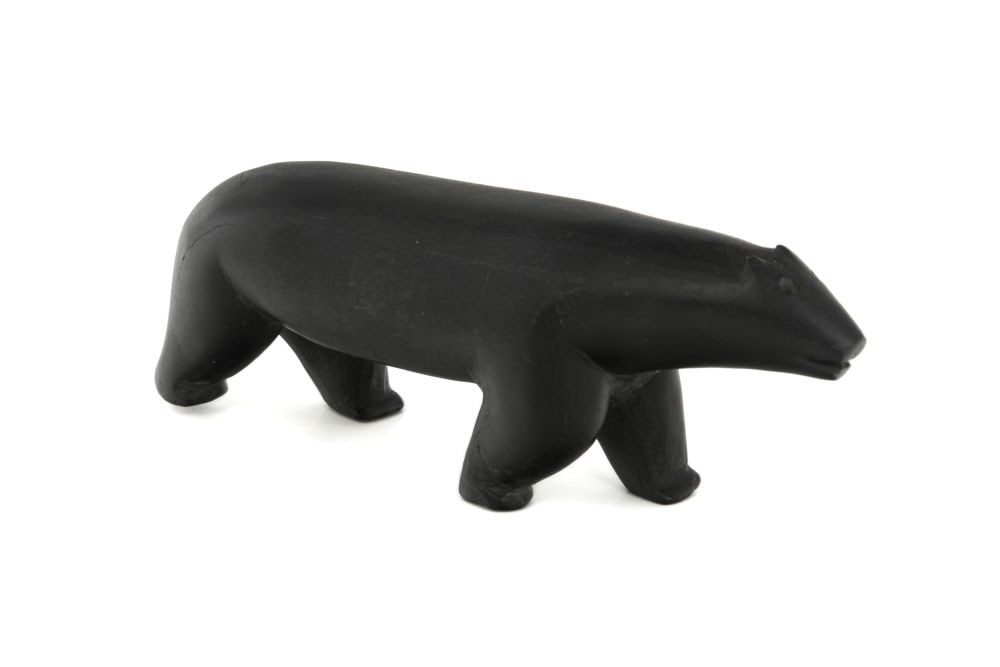 UNIDENTIFIED ARTIST, EASTERN CANADIAN ARCTIC, Striding Polar Bear, mid-late 1950s: UNIDENTIFIED ARTIST, EASTERN CANADIAN ARCTIC Striding Polar Bear, mid-late 1950s stone, 1.75 x 5.5 x 1.25 in (4.4 x 14 x 3.2 cm) unsigned. Provenance Collected by a federal government administrator du