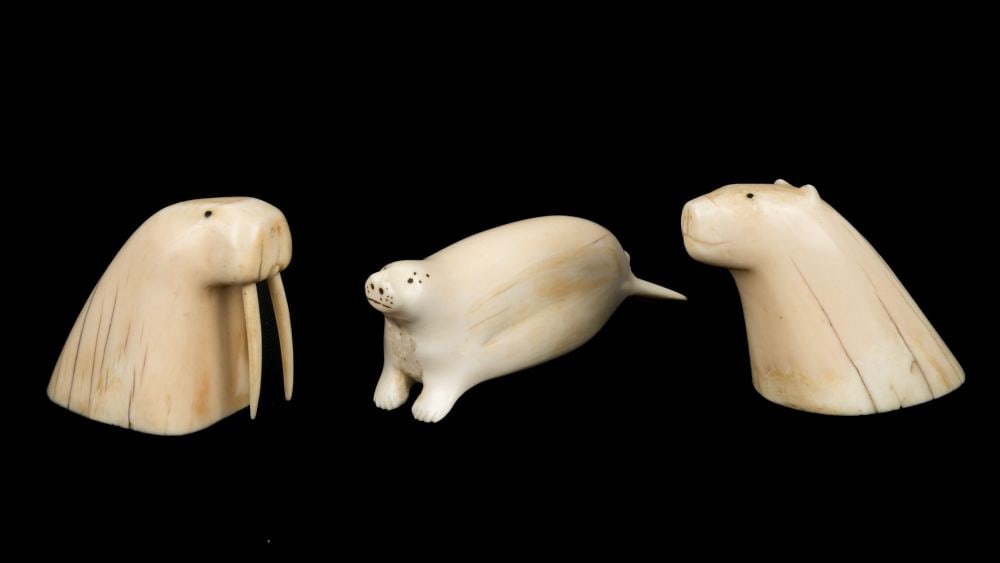 UNIDENTIFIED INUIT ARTISTS, EASTERN CANADIAN ARCTIC, Three Arctic Animals, late 1940s / early 1950s: UNIDENTIFIED INUIT ARTISTS, EASTERN CANADIAN ARCTIC Three Arctic Animals, late 1940s / early 1950s each ivory and black inlay, the largest (basking seal), 1.5 x 4.5 x 1.25 in (3.8 x 11.4 x 3.2 cm) eac