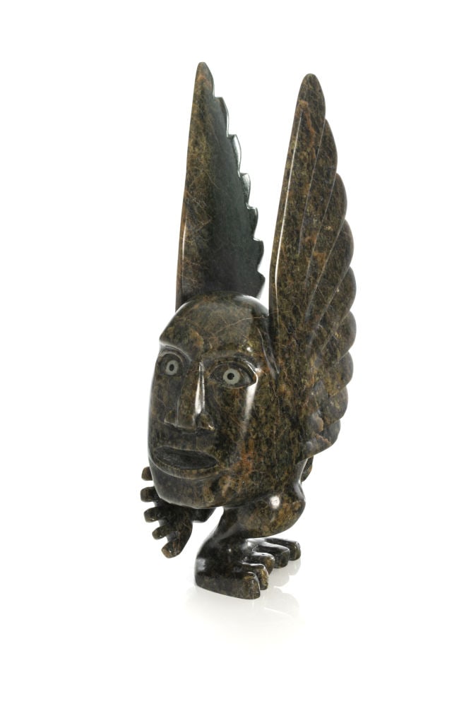 TOONOO SHARKY, INUIT, Winged Spirit, Chanting, 2006: TOONOO SHARKY (1970-) KINNGAIT (CAPE DORSET) Winged Spirit, Chanting, 2006 stone, 11 x 2.75 x 5.5 in (27.9 x 7 x 14 cm) signed and dated, "ᑐᓄ ᓴᑭ / 2006. Provenance Private Coll