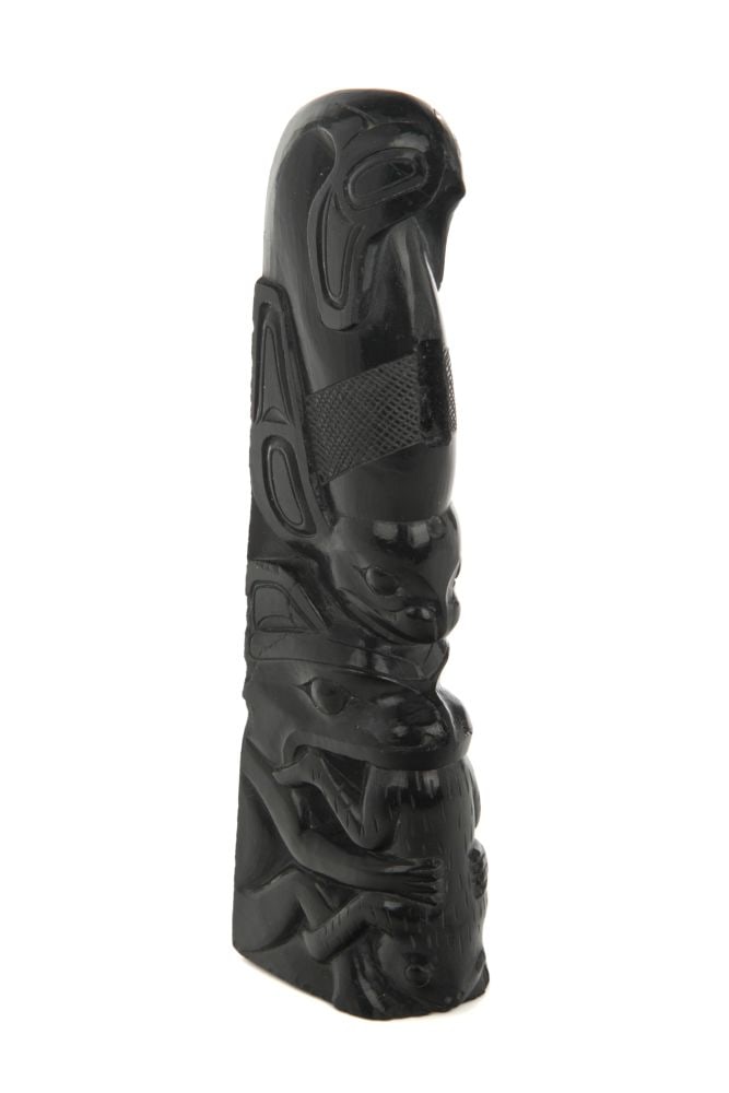 ATTR: JOHN CROSS, HAIDA, Model Totem Pole, c. 1920s / 30s: ATTRIBUTED TO JOHN CROSS (1867-1939) HAIDA Model Totem Pole, c. 1920s / 30s argillite, 5.75 x 1.25 x 1.75 in (14.6 x 3.2 x 4.4 cm) unsigned. condition noted Provenance Private Collection, Toronto; Es