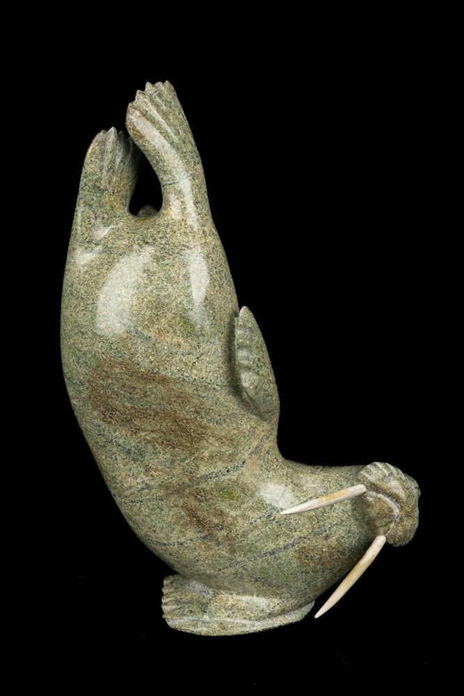 Probably KULULA ITULU, INUIT, Breeching Walrus, 1990s: Probably KULULA ITULU (1952-) KINNGAIT (CAPE DORSET) Breeching Walrus, 1990s stone and antler, 9.75 x 6.5 x 3 in (24.8 x 16.5 x 7.6 cm) signed, "ᐃᑐᓗ" Provenance Private Collection, A