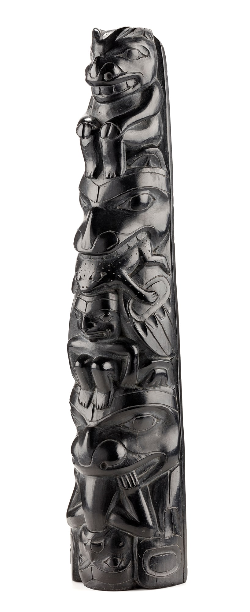UNIDENTIFIED HAIDA ARTIST, NORTHWEST COAST, Hollow Back Model Totem Pole, c. 1890: UNIDENTIFIED HAIDA ARTIST Hollow Back Model Totem Pole, c. 1890 argillite, 9.5 x 2.5 x 1.5 in (24.1 x 6.3 x 3.8 cm) unsigned. Provenance Private Collection, Toronto; Estate of the above. This pole