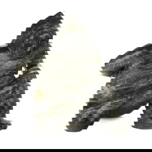 OVILOO TUNNILLIE, INUIT, Man Preparing for Pulling Game, 1990s: OVILOO TUNNILLIE, R.C.A. (1949-2014) KINNGAIT (CAPE DORSET) Man Preparing for Pulling Game, 1990s stone, 17.5 x 14.75 x 14.25 in (44.5 x 37.5 x 36.2 cm) signed and dated, "ᐅᕕᓗ /