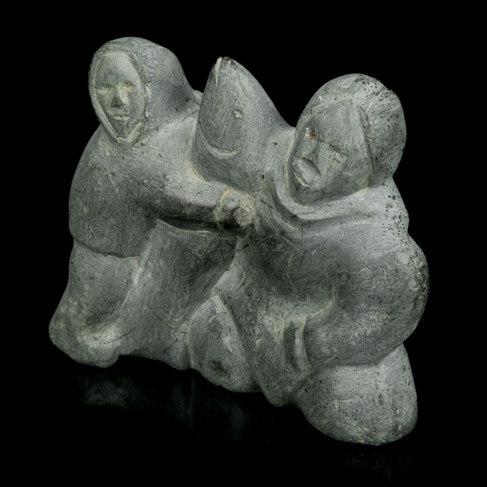 ADA EYETOAQ, INUIT, Mother and Child, with Fish, 1985: ADA EYETOAQ (1934-) QAMANI'TUAQ (BAKER LAKE) Mother and Child, with Fish, 1985 stone, 3.56 x 4.25 x 2.25 in (9 x 10.8 x 5.7 cm) dated and signed, 1985 / ᐅᕈ 23 / ᐃᔨᑐᐊ