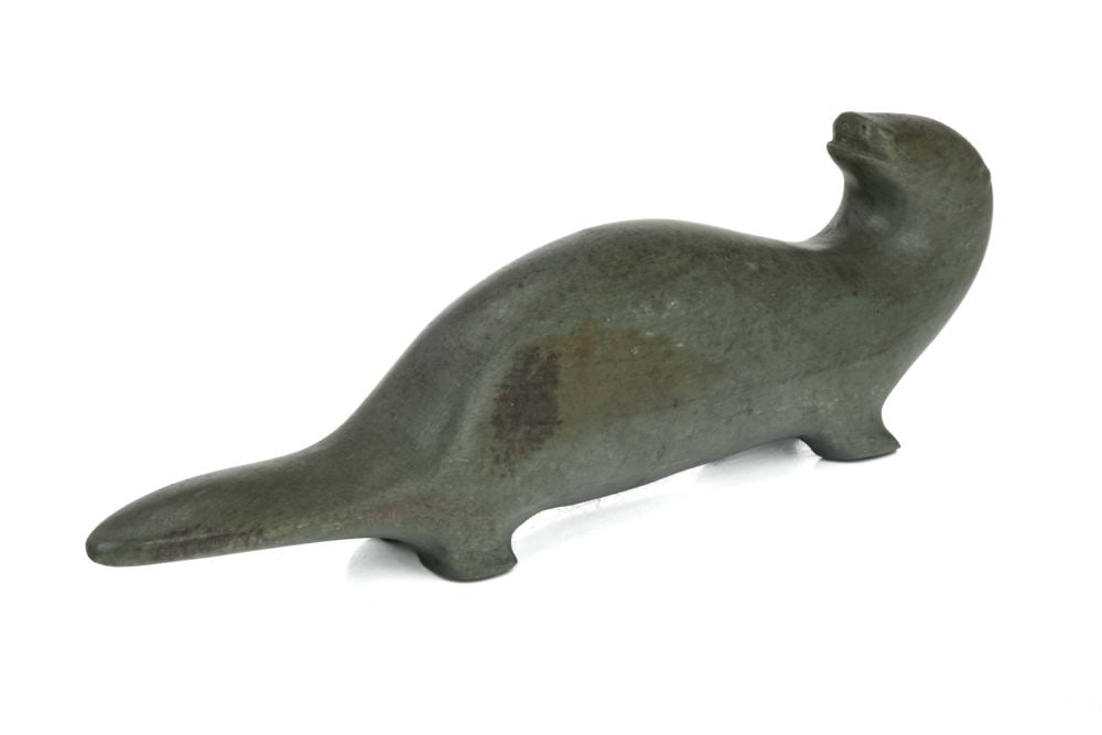 UNIDENTIFIED INUIT ARTIST, Otter Looking Back, c. mid-late 1950s: UNIDENTIFIED INUIT ARTIST, PROBABLY SANIKILUAQ (BELCHER ISLANDS) or KUUJJUARAPIK (GREAT WHALE RIVER) Otter Looking Back, c. mid-late 1950s stone, 2.5 x 8 x 1.25 in (6.3 x 20.3 x 3.2 cm) unsigned. Prov