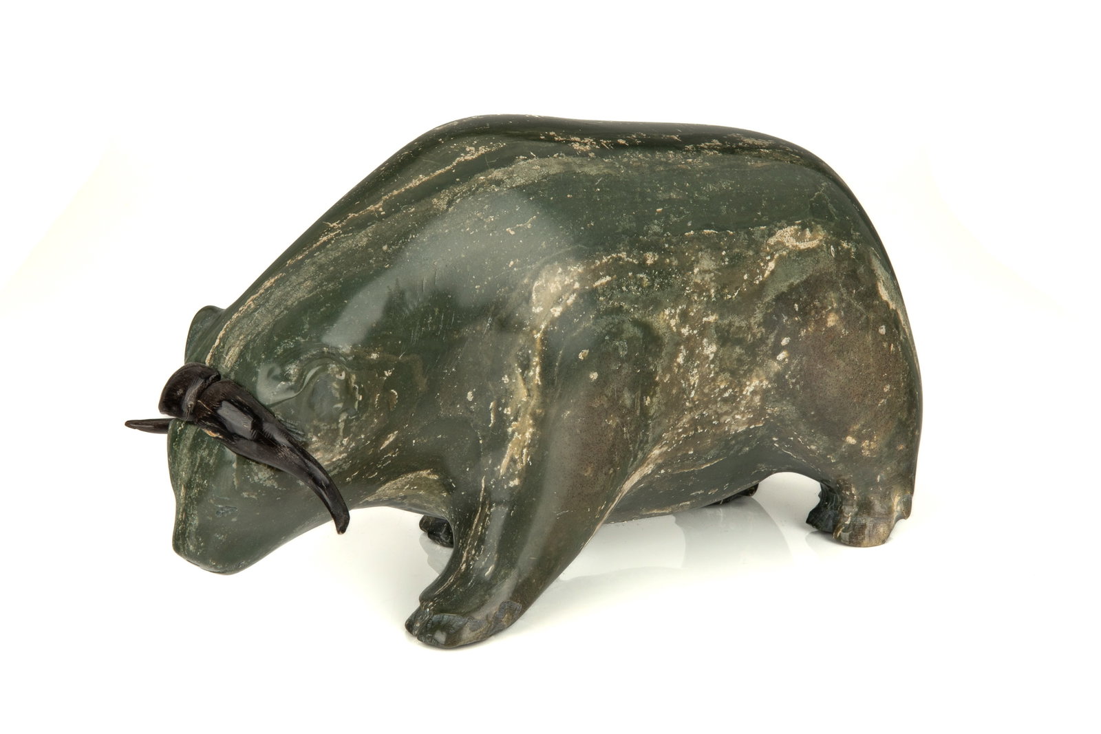 ROGER HITKOLOK, INUIT, Muskox, 1970s: ROGER HITKOLOK (1948-) KUGLUKTUK (COPPERMINE) Muskox, 1970s stone and baleen, 5.25 x 9.25 x 3.25 in (13.3 x 23.5 x 8.3 cm) signed and inscribed, "R. HITKOLOK / COPPERMINE / NWT." Provenance Private Co