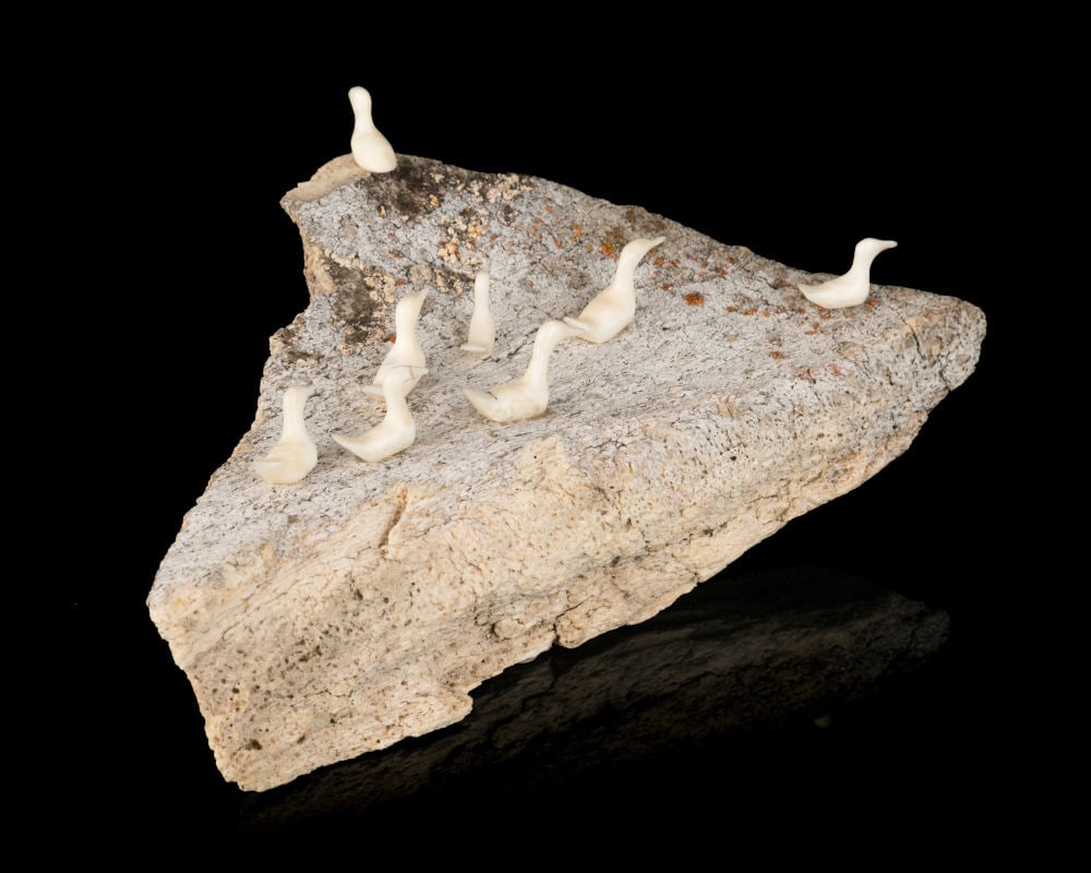 FABIAN OOGARK, INUIT, Rookery, 1980s: FABIAN OOGARK (1923-1992) ARVILIQJUAQ (PELLY BAY) Rookery, 1980s whale bone and walrus walrus tusk, 2.25 x 6 x 3 in (5.7 x 15.2 x 7.6 cm) signed and inscribed, "ᐅᒐ / ᐊᕕᐊ&