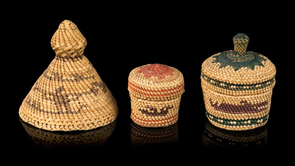 UNIDENTIFIED NUU-CHAH-NULTH ARTISTS, Two Miniature Baskets and a Miniature Rain Hat, 1990s: UNIDENTIFIED NUU-CHAH-NULTH ARTISTS Two Miniature Baskets and a Miniature Rain Hat, 1990s each cedar bark, natural and dyed grasses, the largest: 3 x 3 x 3 in (7.6 x 7.6 x 7.6 cm), and smaller Provena