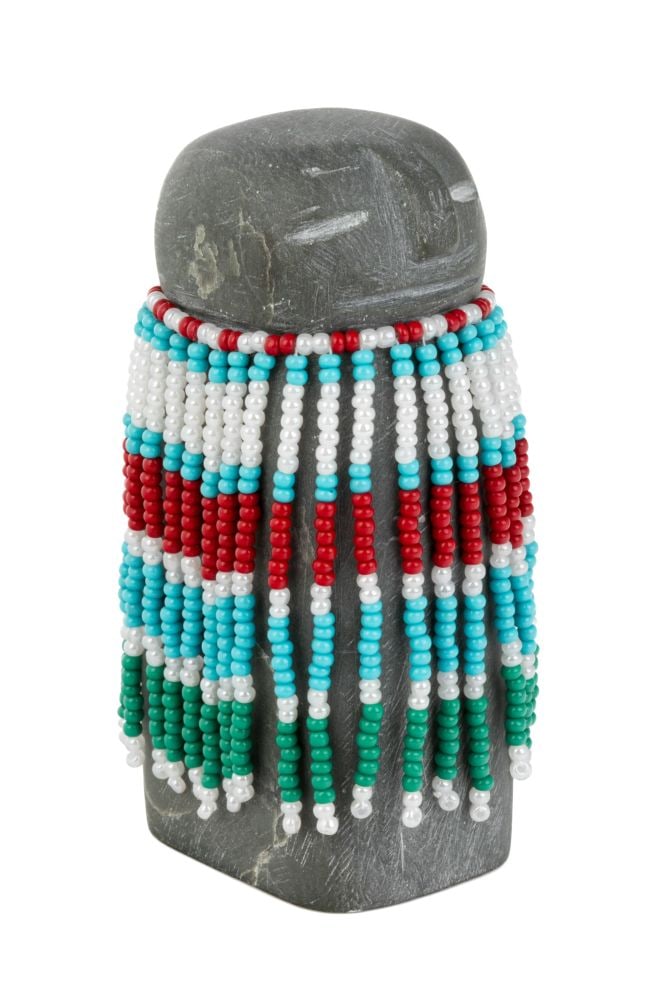 ALICE SAKITNAK AKAMMAK, INUIT, Woman in a Beaded Amautiq,: ALICE SAKITNAK AKAMMAK (1940-) ARVIAT (ESKIMO POINT) Woman in a Beaded Amautiq, stone, beads, and cotton thread, 3.5 x 1.5 x 2 in (8.9 x 3.8 x 5.1 cm) unsigned. Provenance Collection of John and Joyce