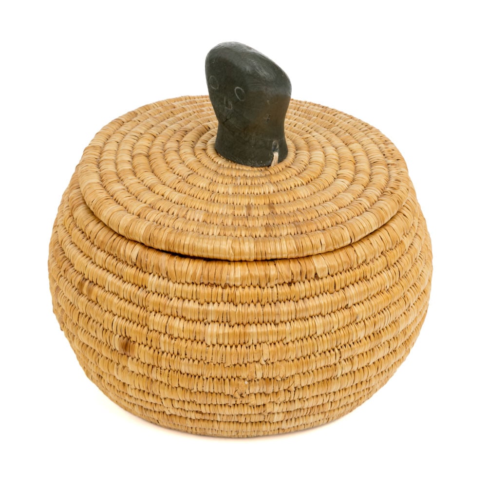 MARY ITTOSHAT, INUIT, Lidded Basket with Face Carved Knob, 1970s: MARY ITTOSHAT, KUUJJUARAPIK (GREAT WHALE RIVER) Lidded Basket with Face Carved Knob, 1970s woven grass, stone, and hide, 6.5 x 7 x 7 in (16.5 x 17.8 x 17.8 cm) unsigned; given to the artist to an affi