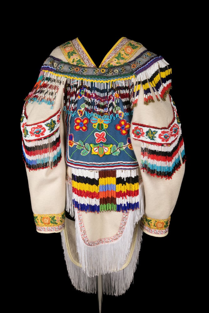 MELANIE KINNIKSIE, INUIT, Beaded Amautiq, 2002: MELANIE KINNIKSIE, ARVIAT (ESKIMO POINT) Beaded Amautiq, 2002 stroud, wool duffle, cotton fabric, glass and plastic beads, cotton and polyester trims, fringe, yarn, sinew, and cotton thread, 47.5 x 24