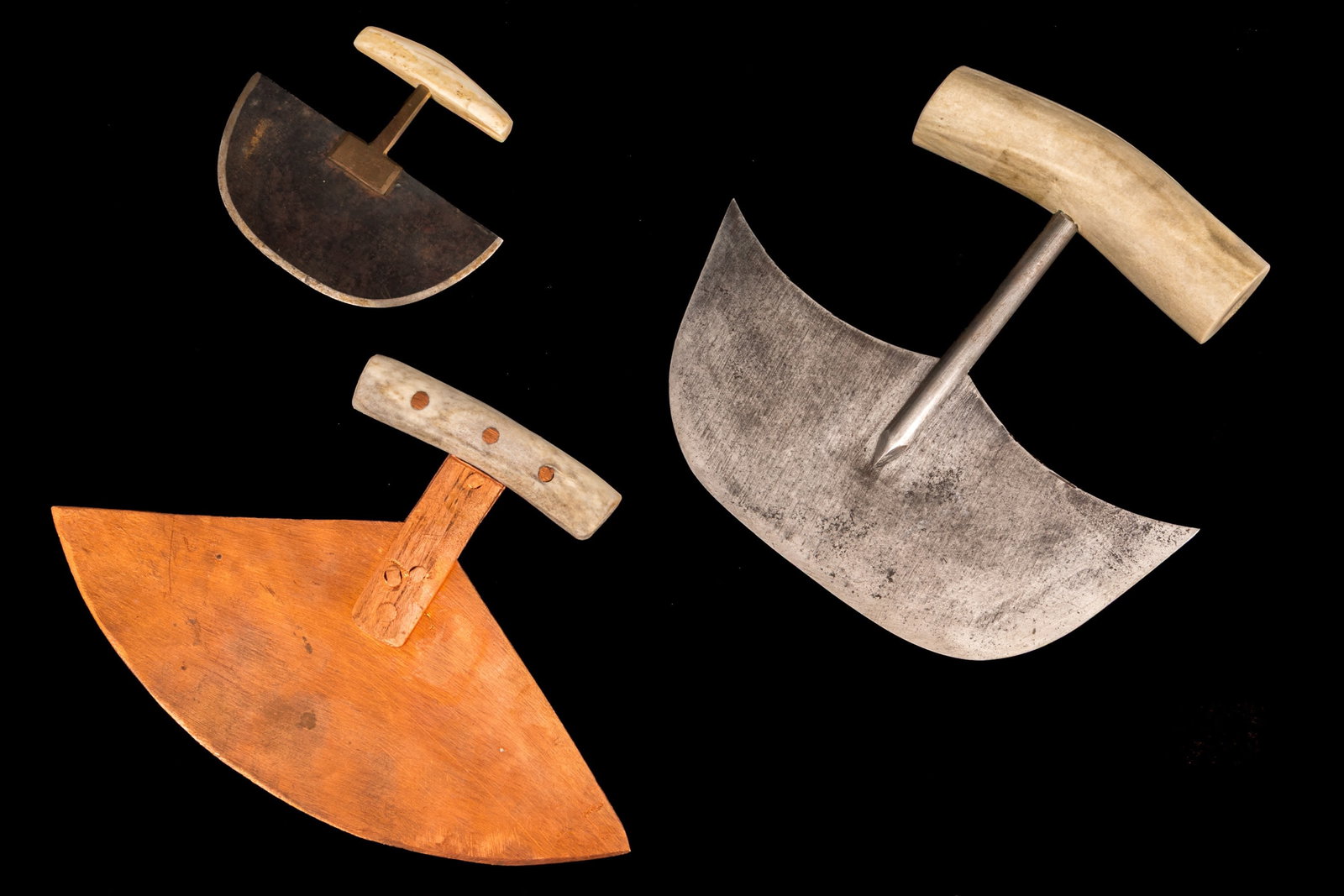UNIDENTIFIED INUIT ARTISTS, Three Ulus, c. 1980s: UNIDENTIFIED INUIT ARTISTS Three Ulus, c. 1980s each metal and antler, the largest: 5.75 x 5.75 x 1.5 in (14.6 x 14.6 x 3.8 cm) and smaller Provenance Ex. Coll. Colin John Grasset Molson (C.J.G ) Coll
