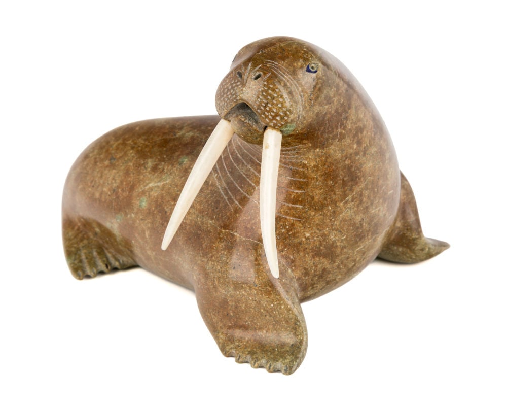 NALENIK TEMELA, INUIT, Resting Walrus, c. 1961: NALENIK TEMELA (1939-2003) KIMMIRUT (LAKE HARBOUR) Resting Walrus, c. 1961 stone and organic material (see firstarts.ca for details), 3.75 x 4 x 5 in (9.5 x 10.2 x 12.7 cm) unsigned; with affixed labe