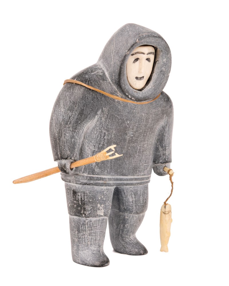 UNIDENTIFIED INUIT ARTIST, NUNAVIK (ARCTIC QUEBEC), Fisherman Setting Out with a Heavy Pack, mid-lat: UNIDENTIFIED INUIT ARTIST, NUNAVIK (ARCTIC QUEBEC) Fisherman Setting Out with a Heavy Pack, mid-late 1950s stone, leather, wood, antler, and string, 5.5 x 3.25 x 2.5 in (14 x 8.3 x 6.3 cm) unsigned. P