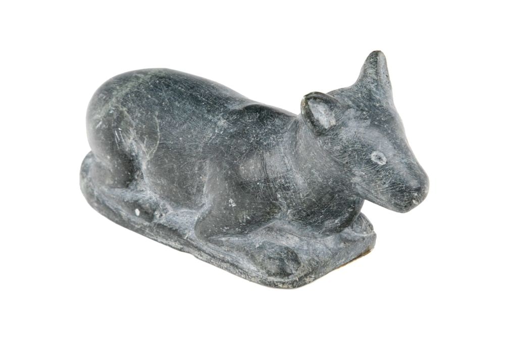 SAMUILI ITUKALLA, INUIT, Young Caribou, Nestled on the Tundra, c. late 1950s or early 1960s: SAMUILI ITUKALLA, PUVIRNITUQ (POVUNGNITUK) Young Caribou, Nestled on the Tundra, c. late 1950s or early 1960s stone, 1.75 x 3.5 x 1 in (4.4 x 8.9 x 2.5 cm) inscribed with artist's disc number, "E 9 _