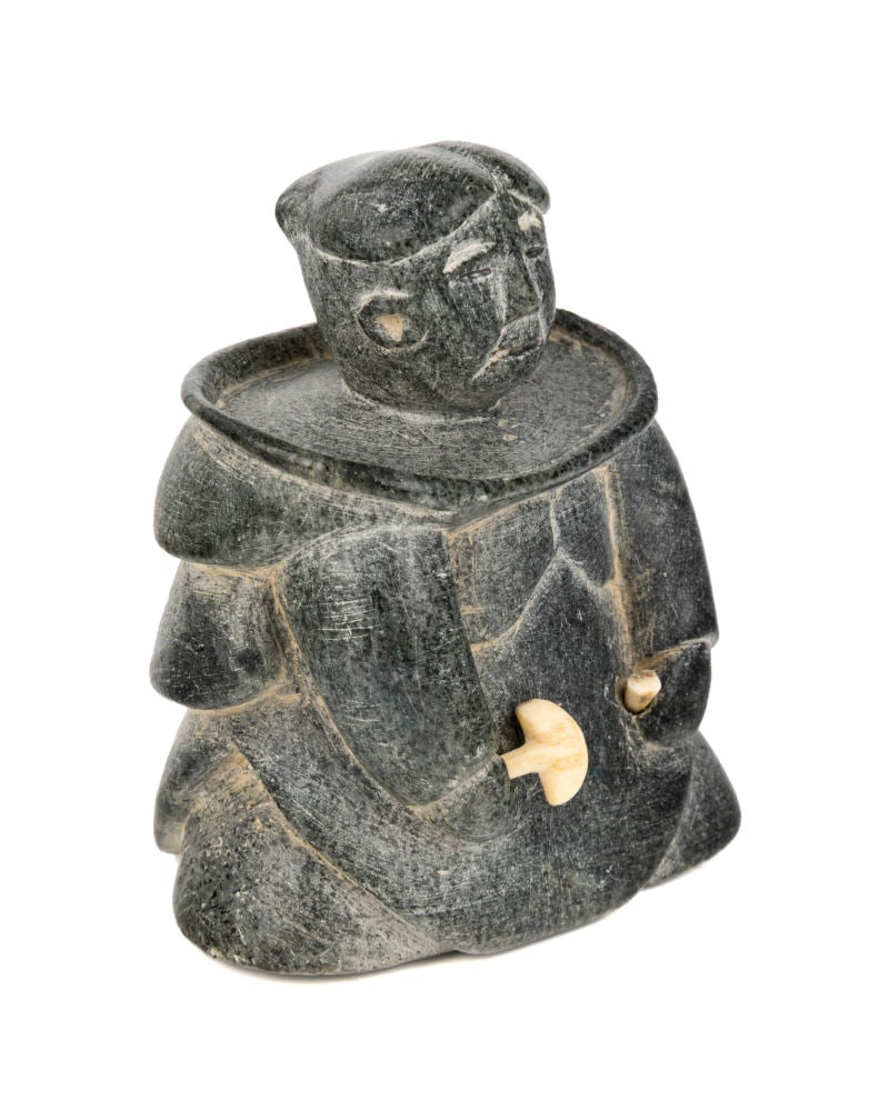 UNIDENTIFIED INUIT ARTIST, Probably INUKJUAK (PORT HARRISON), Kneeling Woman with Taqqut and Ulu, c.: UNIDENTIFIED ARTIST, Probably INUKJUAK (PORT HARRISON) Kneeling Woman with Taqqut and Ulu, c. late 1950s / early 1960s stone and antler, 3.25 x 2.5 x 1.75 in (8.3 x 6.3 x 4.4 cm) unsigned. Provenance 