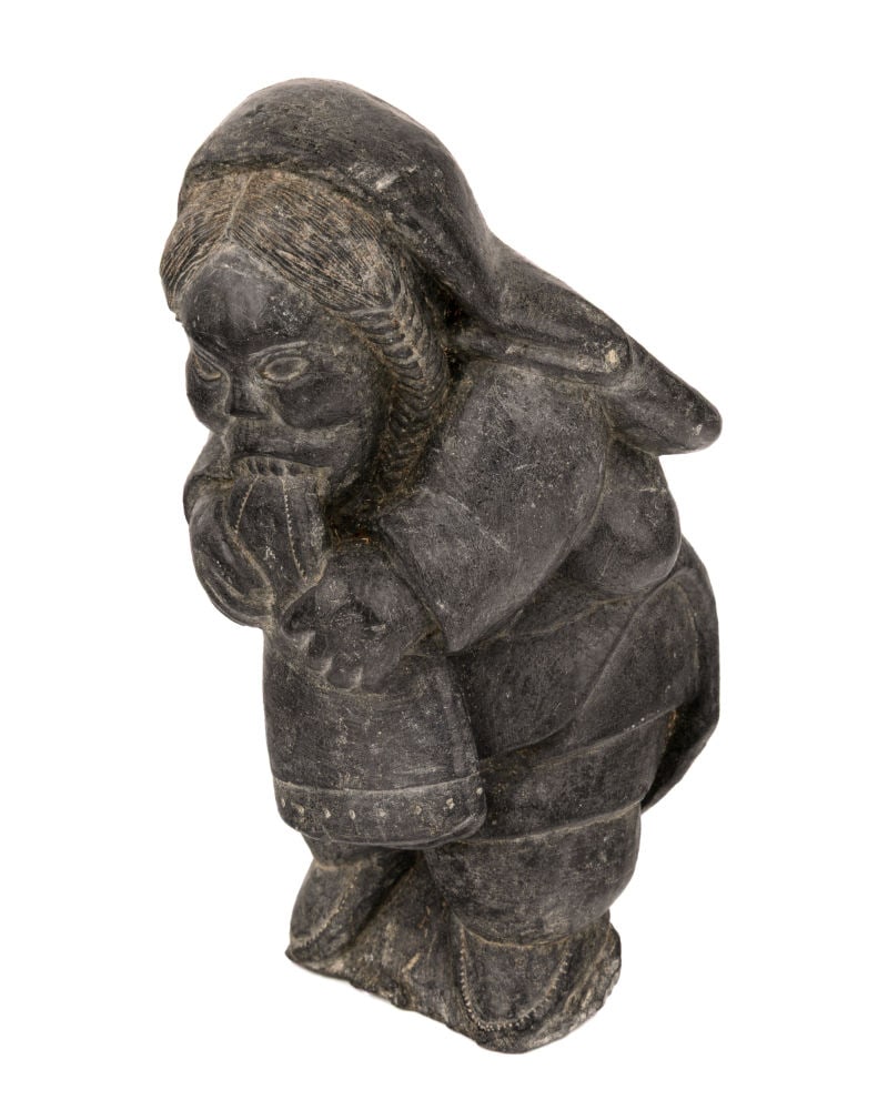 DAVIDEE SAUMIK, INUIT, Woman Softening a Kamik, 1962: DAVIDEE SAUMIK (1925-1984) INUKJUAK (PORT HARRISON) Woman Softening a Kamik, 1962 stone, 6 x 3 x 3.25 in (15.2 x 7.6 x 8.3 cm) signed and inscribed with artist's partial disc number, "ᑕᐃ&#