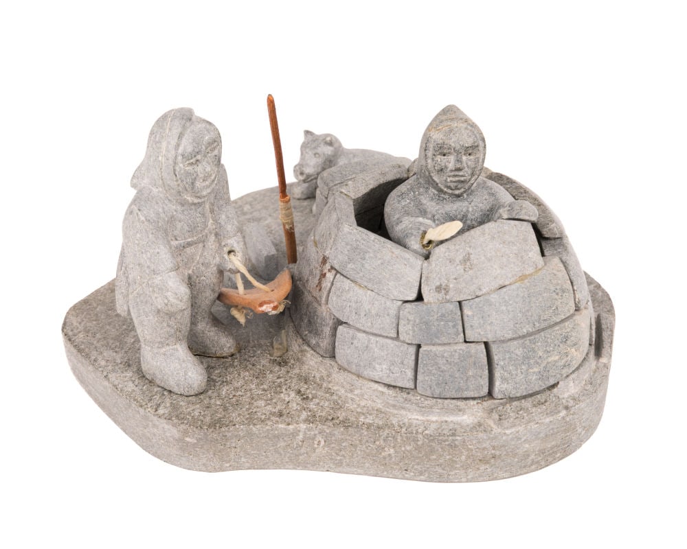 AGNES TOPIAK, INUIT, Two Figures Building a Snow Shelter, Dog Resting Nearby, c. 1958: AGNES TOPIAK (1905-1979) KUGLUKTUK (COPPERMINE) Two Figures Building a Snow Shelter, Dog Resting Nearby, c. 1958 stone, wood, copper, and string, 3.25 x 6 x 5.75 in (8.3 x 15.2 x 14.6 cm) signed, "AGN