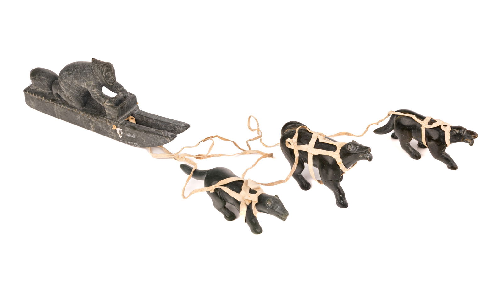 DANIEL OWEETALUKTUK, INUIT, Man on Qamutiik (Komatik) with Three Sled Dogs, c. 1960s (1 of 4)