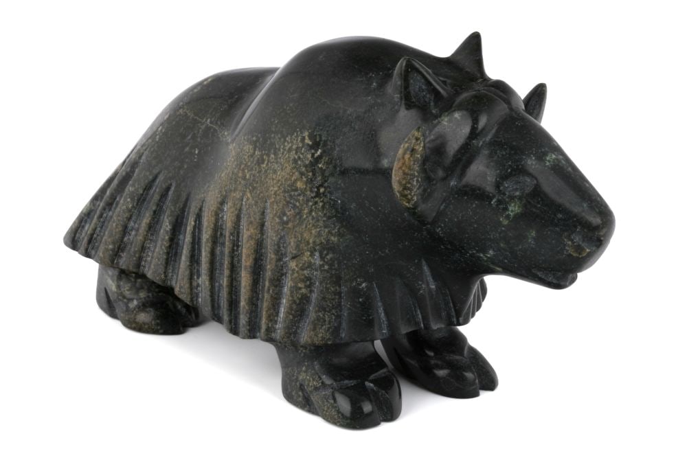 Probably QIATSUQ SHAA, INUIT, Muskox, 2000s: Probably QIATSUQ SHAA (1971-1998) KINNGAIT (CAPE DORSET) Muskox, 2000s stone, 4.25 x 8.25 x 3 in (10.8 x 21 x 7.6 cm) unsigned. Provenance A Toronto Collection. Muskoxen are a large hoofed mammal nat