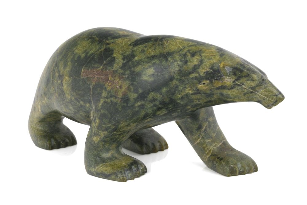 JOHNNY SAGIATUK, INUIT, Lumbering Polar Bear, 1996: JOHNNY SAGIATUK (1964-) KINNGAIT (CAPE DORSET) Lumbering Polar Bear, 1996 stone, 3.5 x 9 x 4.5 in (8.9 x 22.9 x 11.4 cm) signed, dated, and inscribed, "ᔭᓂ/ ᓴᒋᐊᑐ / 9