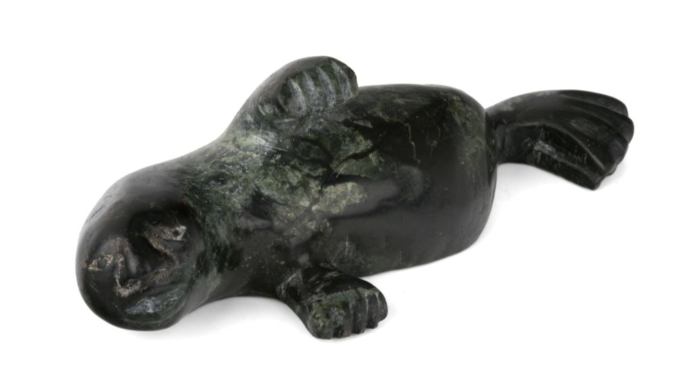 CEE POOTOOGOOK, INUIT, Swimming Walrus Shaman, 1990s: CEE POOTOOGOOK (1967-) KINNGAIT (CAPE DORSET) Swimming Walrus Shaman, 1990s stone, 1.5 x 4.5 x 1.75 in (3.8 x 11.4 x 4.4 cm) signed, "ᓯ ᐳᑐᒍᖅ". Provenance A Toronto Collec