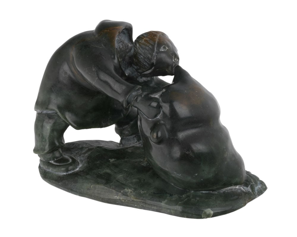 DANIEL INUKPUK, INUIT, Man with Avataq, 1997: DANIEL INUKPUK (1942-2015) INUKJUAK (PORT HARRISON) Man with Avataq, 1997 stone, 4.75 x 3.25 x 4 in (12.1 x 8.3 x 10.2 cm) dated and signed, "97 / ᑕᓂᐊᓕ ᐃᓄᐳ". 