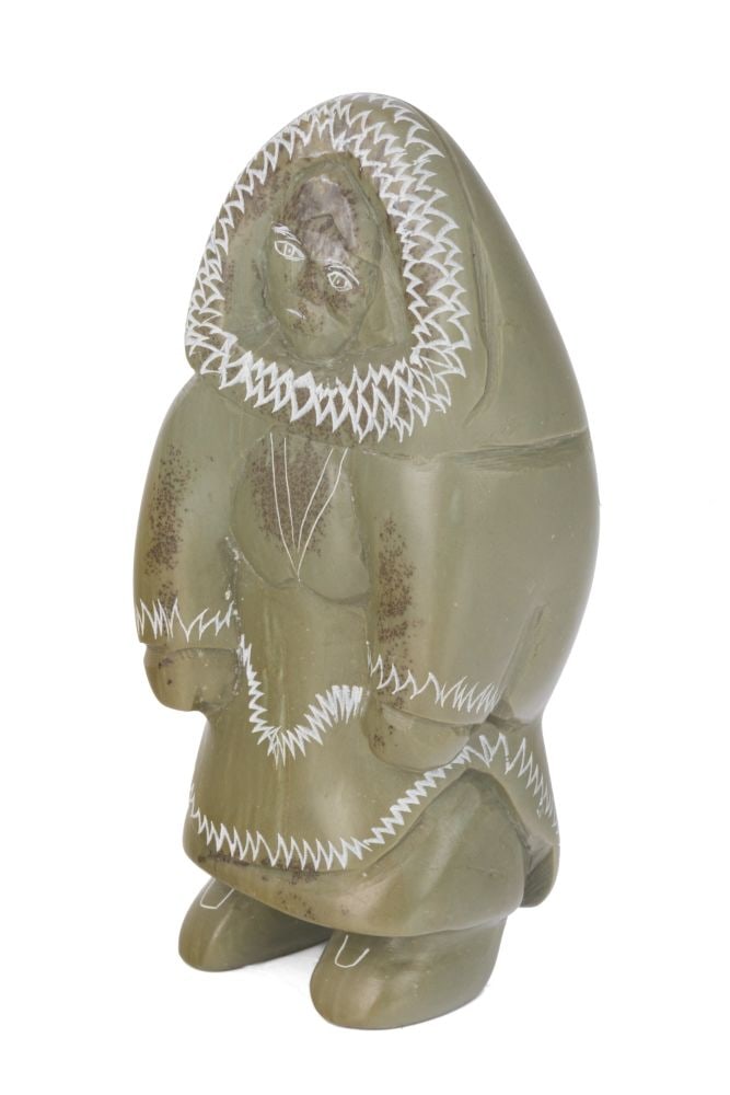 ANNIE NOVALINGA, INUIT, Standing Woman in an Amautiq, 1990s / 2000s: ANNIE NOVALINGA (1951-) SANIKILUAQ (BELCHER ISLAND) Standing Woman in an Amautiq, 1990s / 2000s stone, 5.25 x 2.25 x 2 in (13.3 x 5.7 x 5.1 cm) signed, "ANNIE / NOVALINGA". Provenance A Toronto Collec