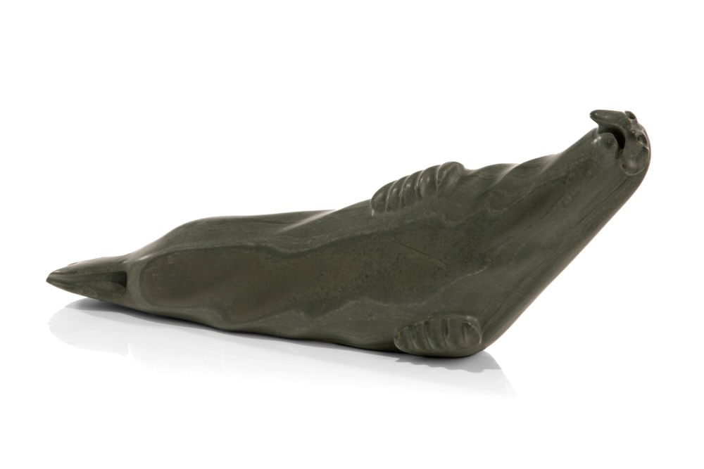 CHARLIE QITTUSUK, INUIT, Basking Seal, 1970s: CHARLIE QITTUSUK (1927-d) BELCHER ISLAND (SANIKILUAQ) Basking Seal, 1970s stone, 5 x 16 x 3 in (12.7 x 40.6 x 7.6 cm) inscribed with artist's disc number and signed, "E.9 -109 / ᓴᓕ ᑭ