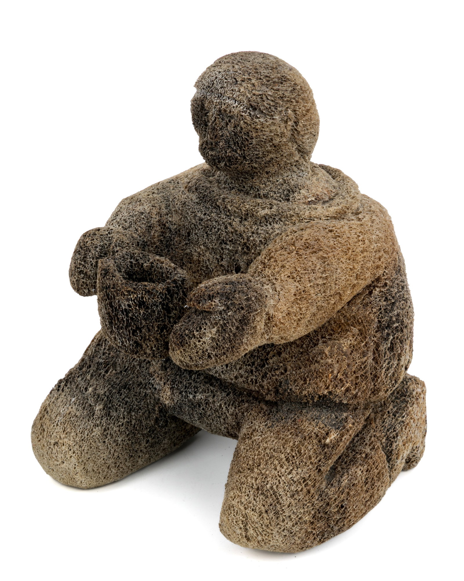 UNIDENTIFIED INUIT ARTIST, Kneeling Figure with Vessel, 1970s: UNIDENTIFIED ARTIST, POSSIBLY: KANGIQTUGAAPIK (CLYDE RIVER) OR IQALUIT (FROBISHER BAY) Kneeling Figure with Vessel, 1970s whale bone, 13 x 9 x 9.5 in (33 x 22.9 x 24.1 cm) unsigned. Provenance Private