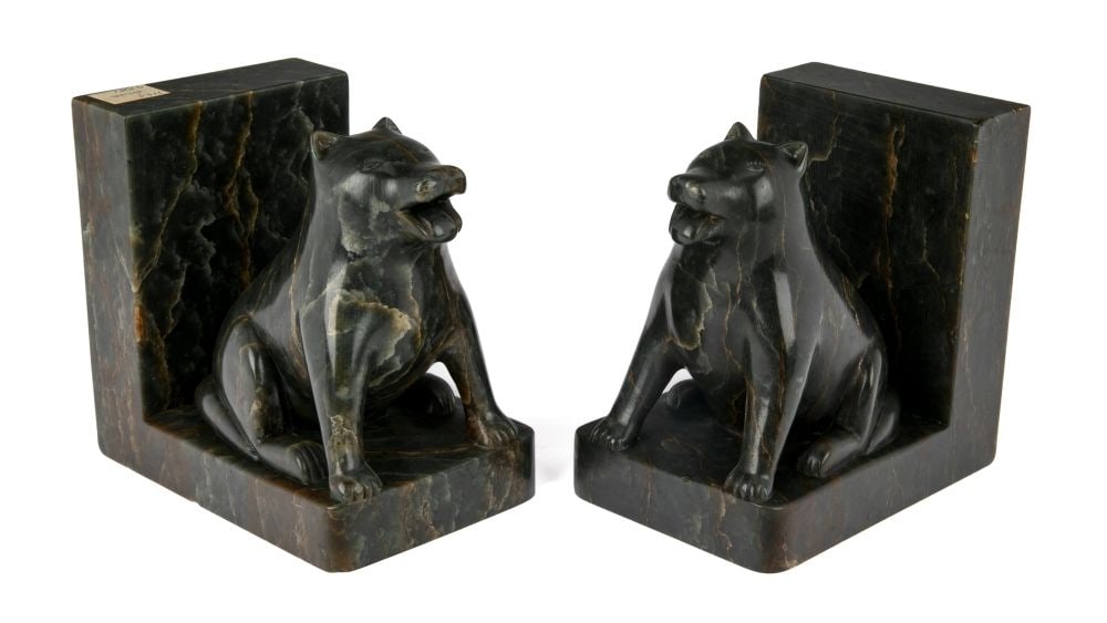 SIMON KASUDLUAK, INUIT, Pair of Bookends with Content, Panting Dogs, 1960: SIMON KASUDLUAK (1925-D) INUKJUAK (PORT HARRISON) Pair of Bookends with Content, Panting Dogs, 1960 stone, 5.25 x 5 x 3.75 in (13.3 x 12.7 x 9.5 cm) inscribed with artist's disc number, "E9 1716"; wit