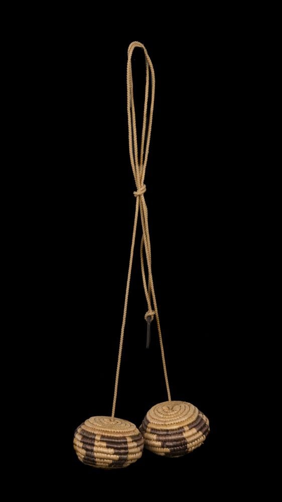 UNKNOWN CENTRAL YUP’IK ARTIST, INUIT, c. 1980s/90s: UNKNOWN CENTRAL YUP’IK ARTIST Yuuyuuk (Bolas /Alaskan Yo-yo / Eskimo Yo-yo)c. 1980s/90s grass, string, and stone, dimensions variable, each "weight": 1.5 x 2 x 2 in (3.8 x 5.1 x 5.1 cm) ESTIMATE: $1