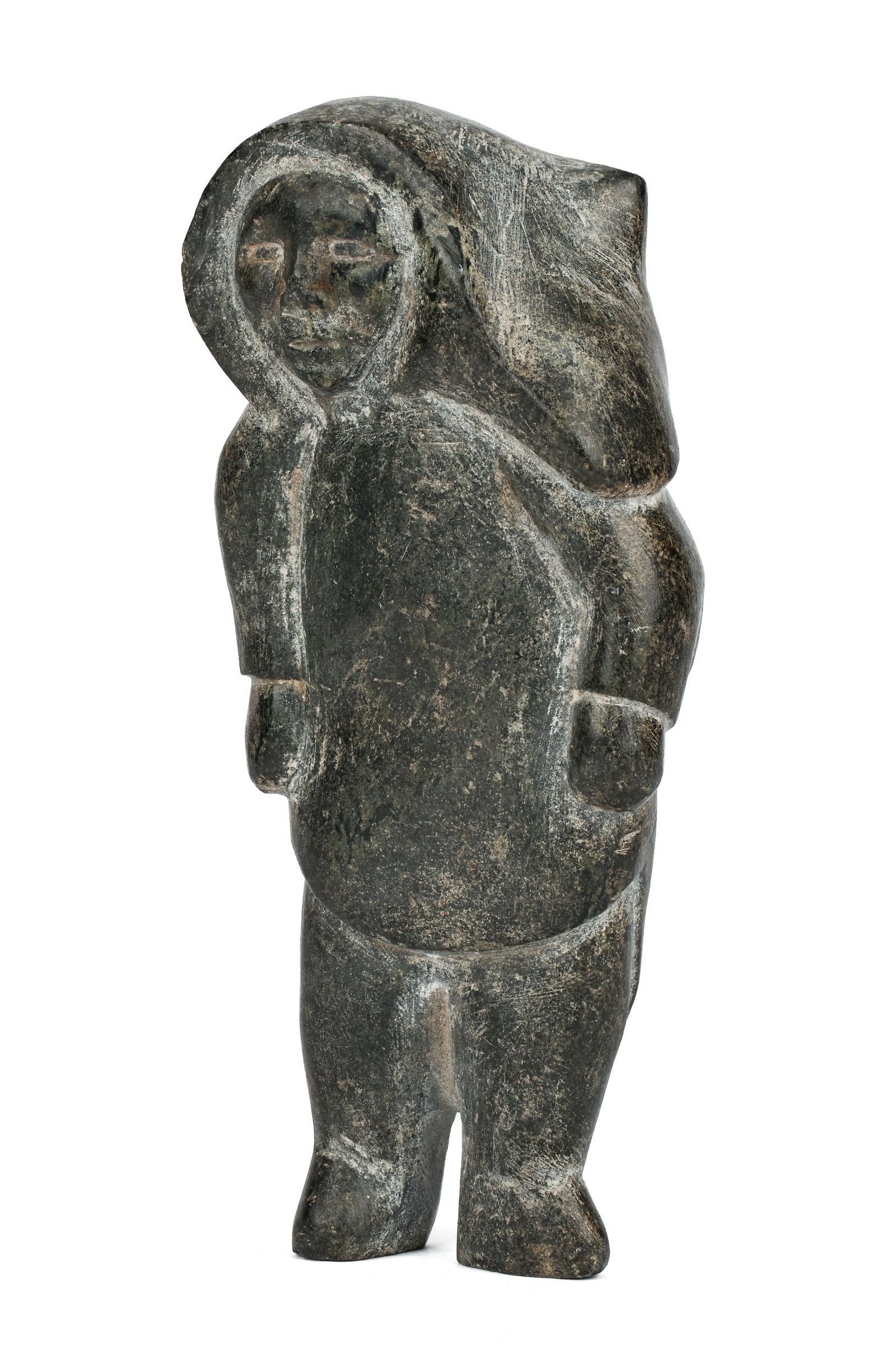 UNIDENTIFIED INUIT ARTIST, Standing Woman in Amautiq, c. 1955: UNIDENTIFIED INUIT ARTIST, KINNGAIT (CAPE DORSET) Standing Woman in Amautiq, c. 1955 stone, 7 x 3.25 x 2 in (17.8 x 8.3 x 5.1 cm) unsigned. Provenance An American Private Collection. This charming fig