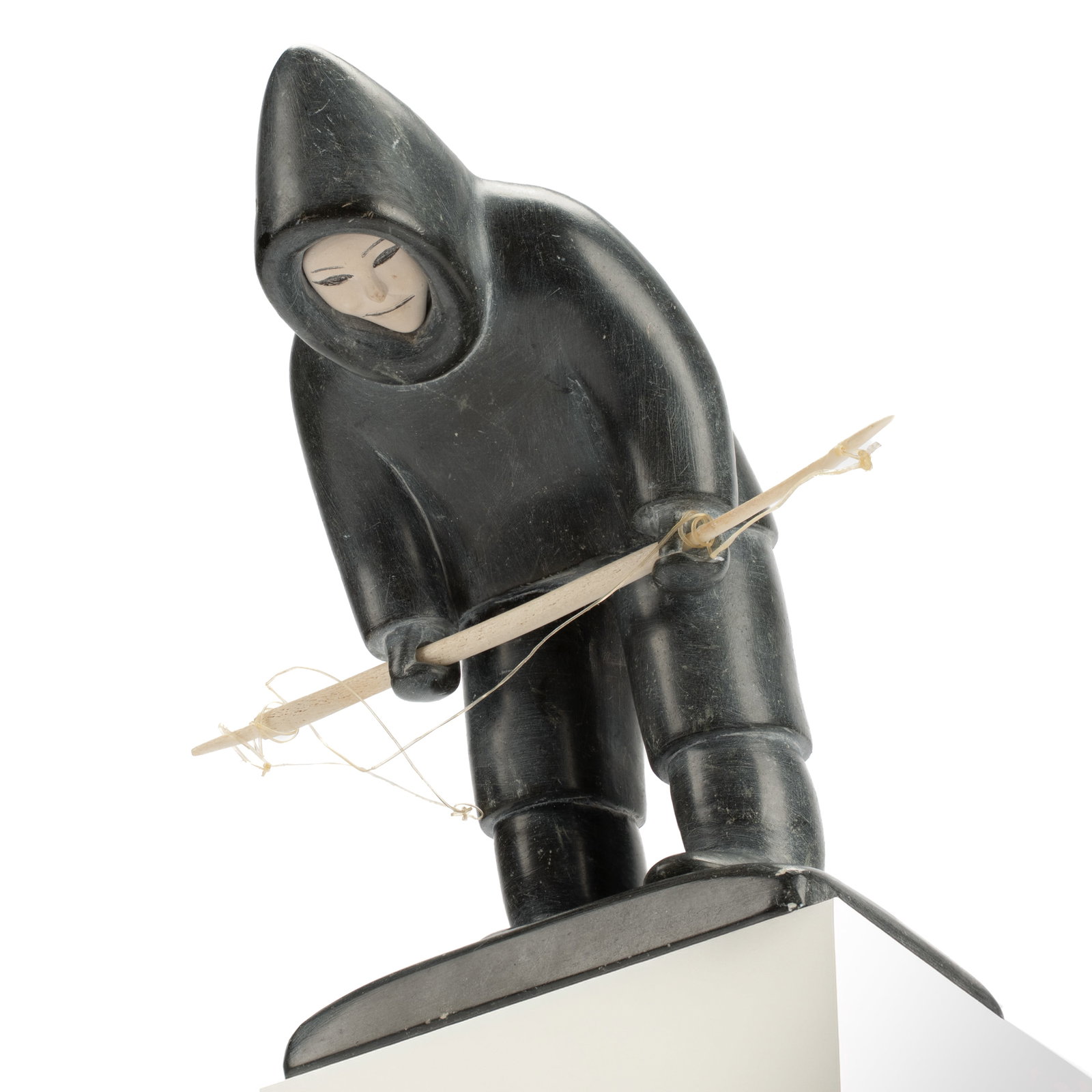 UNIDENTIFIED ARTIST, INUIT, The Patient Hunter, c. 1949 to early 1950s: UNIDENTIFIED ARTIST, NUNAVIK (ARCTIC QUEBEC) The Patient Hunter, c. 1949 to early 1950s stone, antler, string, and graphite, 5.5 x 5.5 x 4.75 in (14 x 14 x 12.1 cm) unsigned. Provenance Ex. Coll. Coli