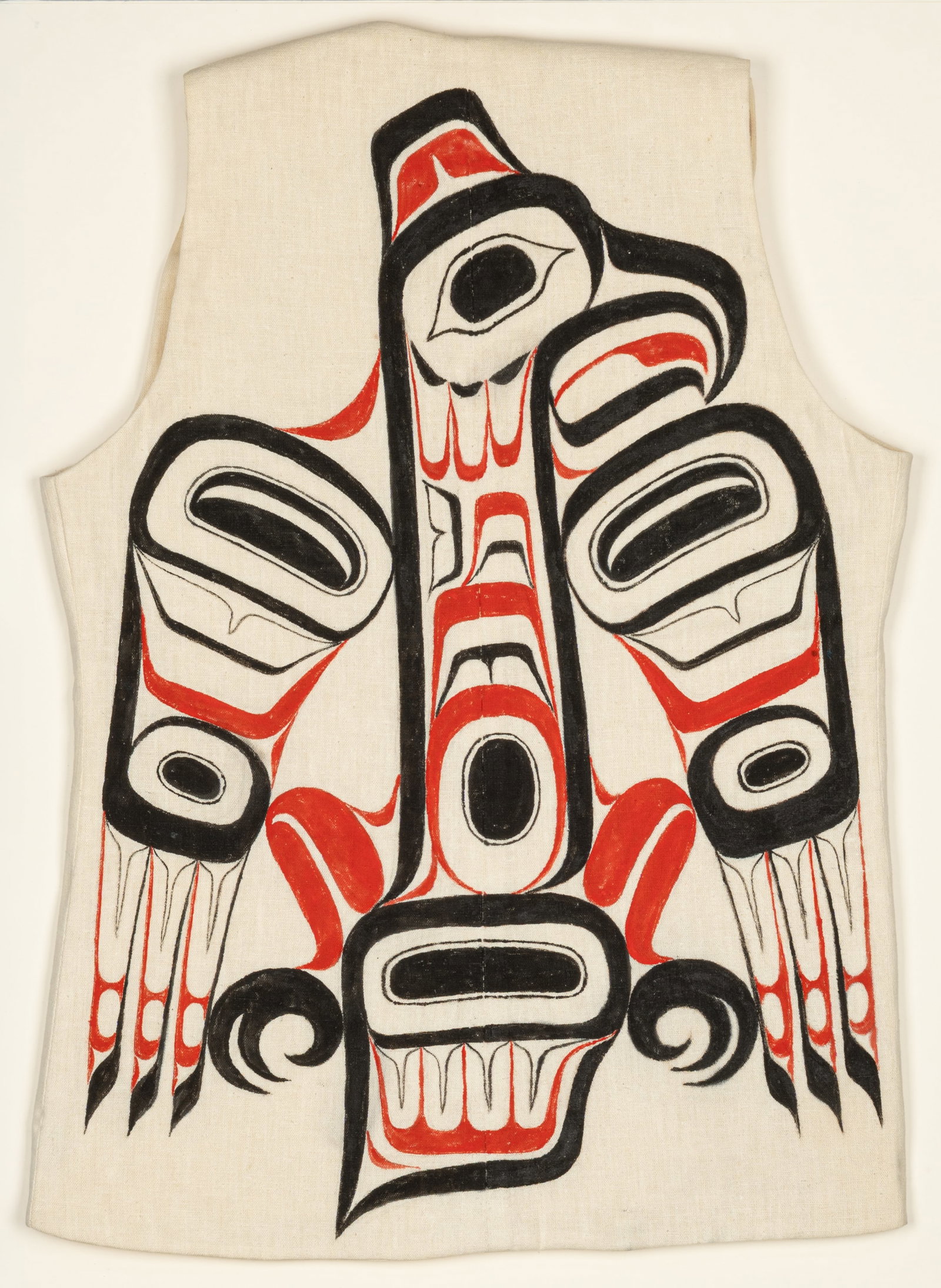 BILL REID (IIJUWAS), HAIDA, Eagle Painted Vest, c. 1970s: BILL REID (IIJUWAS), O.B.C., R.C.A. (1920-1998), HAIDA Eagle Painted Vest, c. 1970s cotton fabric and acrylic paint, 26 x 16 in (66 x 40.6 cm), irregular, framed. signed to the affixed placard, within